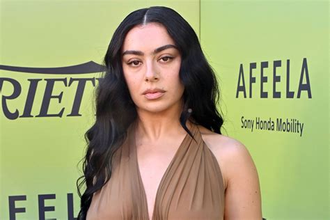 Charli XCX Frees the Nipple In a Nude Lingerie Dress For。